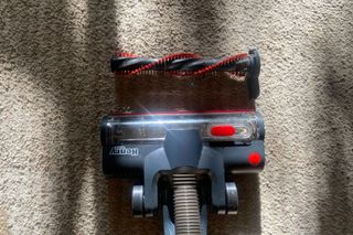 Henry Quick vacuum roller brush head on carpet with roller brush taken out and cleaned sitting above it