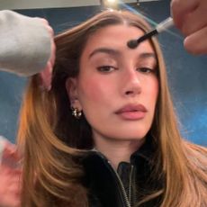 Selfie of Hailey Bieber as she gets her makeup and hair done.