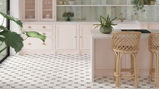 Pink shaker kitchen with vintage green and white floor tiles and wicker bar stools