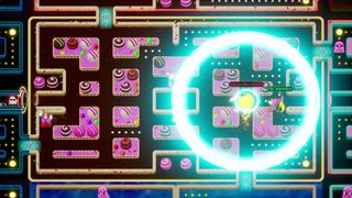 Pac-Men compete in a glowing maze