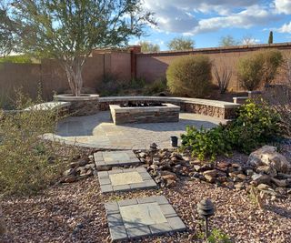 circular paved patio surrounded by gravel garden