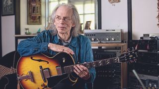 Steve Howe poses with his guitar collection at his home in Romanleigh, Devon. May 22, 2012