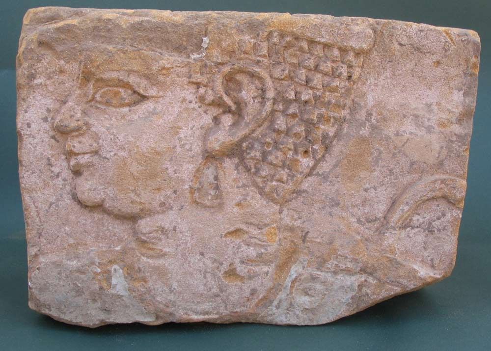 ancient relief with carving of princess 