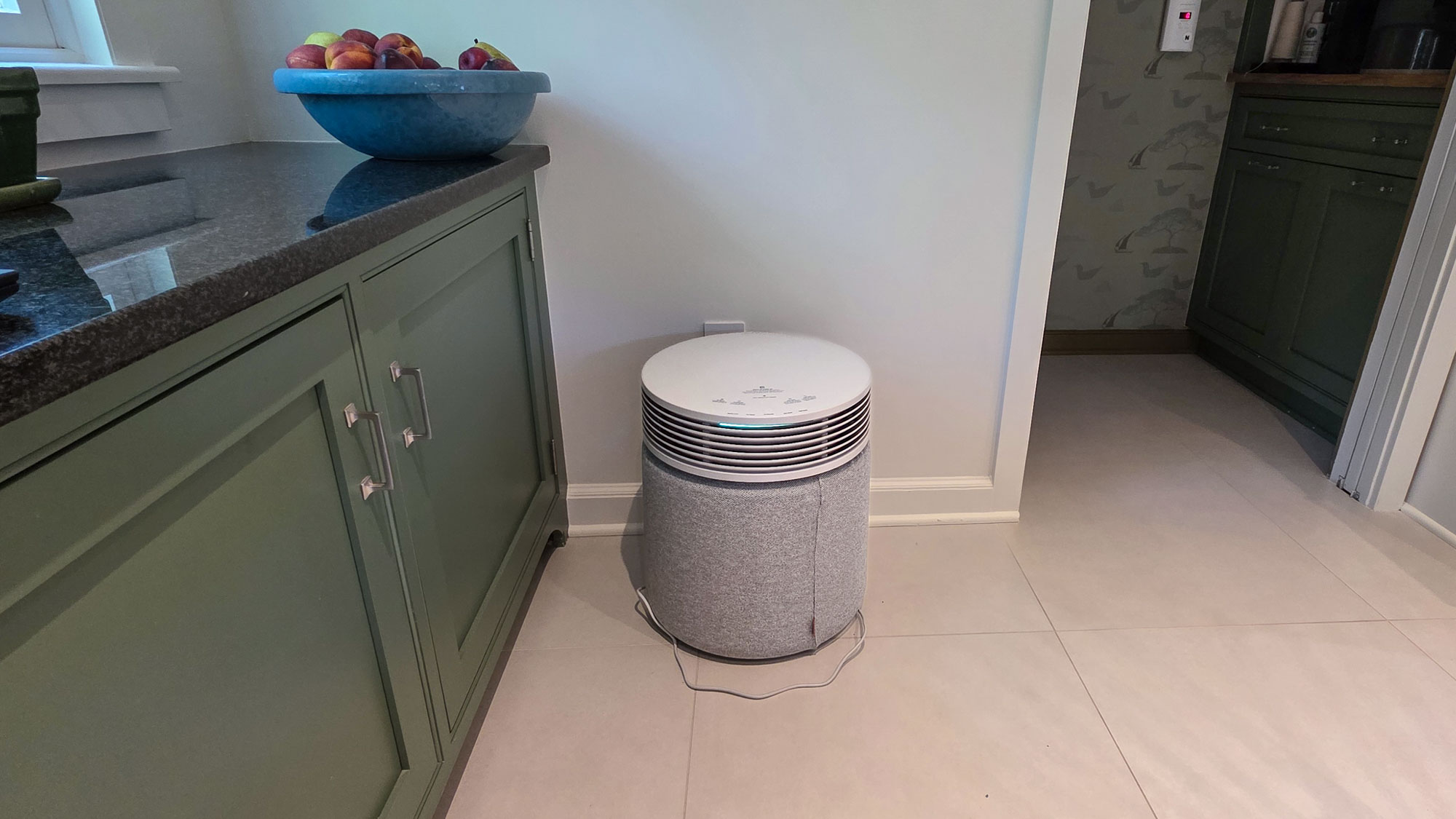 Blueair Blue Signature purifier on white tiled floor