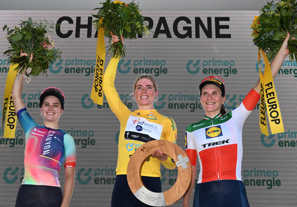CHAMPAGNE SWITZERLAND JUNE 18 LR Neve Bradbury of Australia and Team CanyonSram Racing on second place race winner Demi Vollering of The Netherlands and Team SD WorxProtime Yellow Leader Jersey and Elisa Longo Borghini of Italy and Team LidlTrek on third place pose on the podium ceremony after the 4th Tour de Suisse Women 2024 Stage 4 a 1275km stage from Champagne to Champagne UCIWWT on June 18 2024 in Champagne Switzerland Photo by Tim de WaeleGetty Images