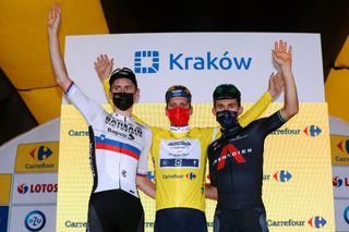 KRAKOW POLAND AUGUST 15 LR Matej Mohoric of Slovenia and Team Bahrain Victorious on second place race winner Joo Pedro Gonalves Almeida of Portugal and Team Deceuninck QuickStep Yellow Leader Jersey and Michal Kwiatkowski of Poland and Team INEOS Grenadiers on third place pose on the podium during the podium ceremony after the 78th Tour de Pologne 2021 Stage 7 a 145km stage from Zabrze to Krakw TourdePologne TDP2021 UCIWT on August 15 2021 in Krakow Poland Photo by Bas CzerwinskiGetty Images