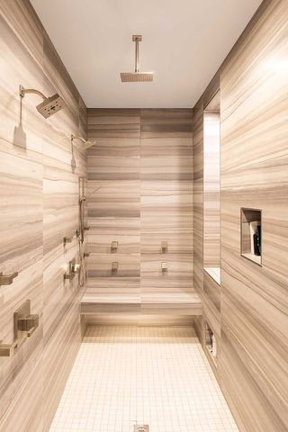 A bathroom with a steam shower