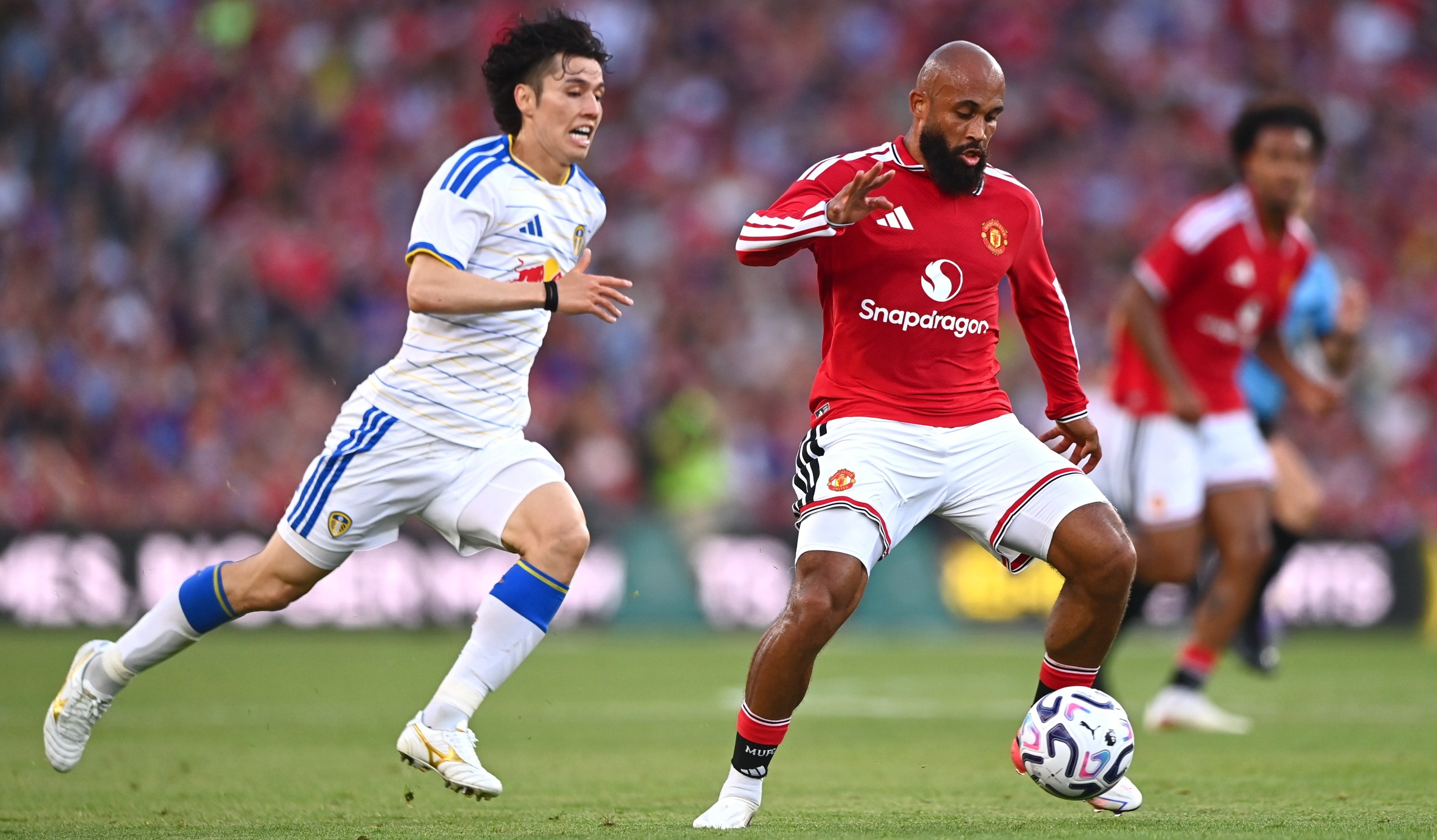 Bryan Mbeumo of Manchester United in action against Ao Tanaka of Leeds United during the pre-season friendly match between Manchester United and Leeds United at Croke Park in Dublin
