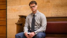 Bobby Schofield as Joe (sitting on bench with coffee cup in hand)