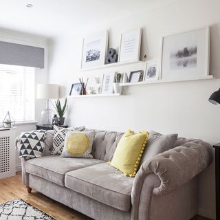 living room with sofaset and white walls