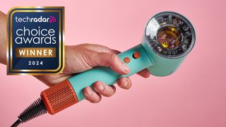 Dyson Nural in a hand, with sign saying TechRadar Choice Awards 2024 Winner