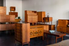 danish midcentury cabinets stacked and showing contemporary bowls