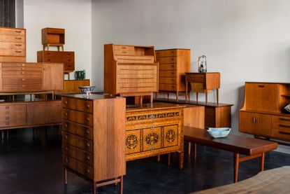 danish midcentury cabinets stacked and showing contemporary bowls