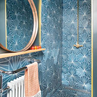 Wet room covered in patterned tiles