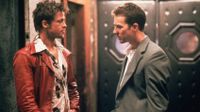 A still from Fight Club with actors Brad Pitt and Edward Norton staring at each other 