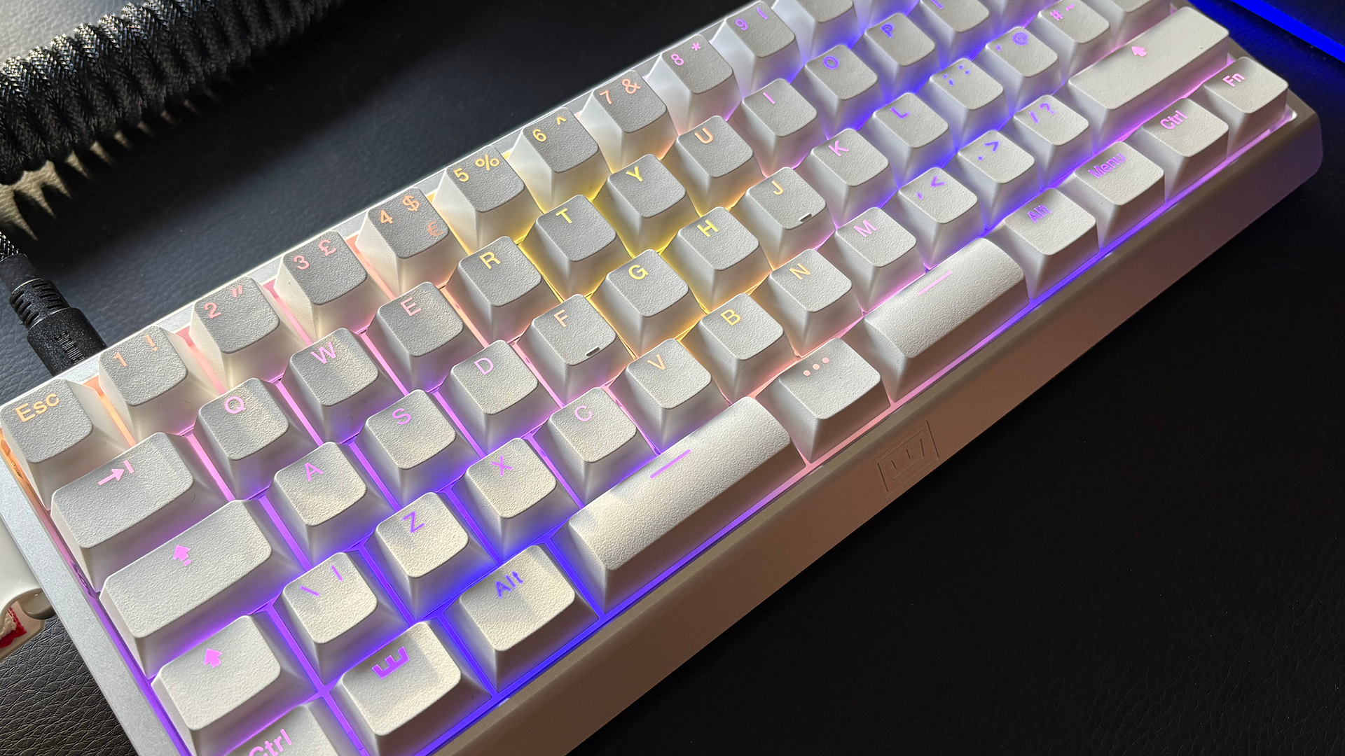 The Wooting 60HE v2 with a split spacebar in white and with RGB lighting enabled.