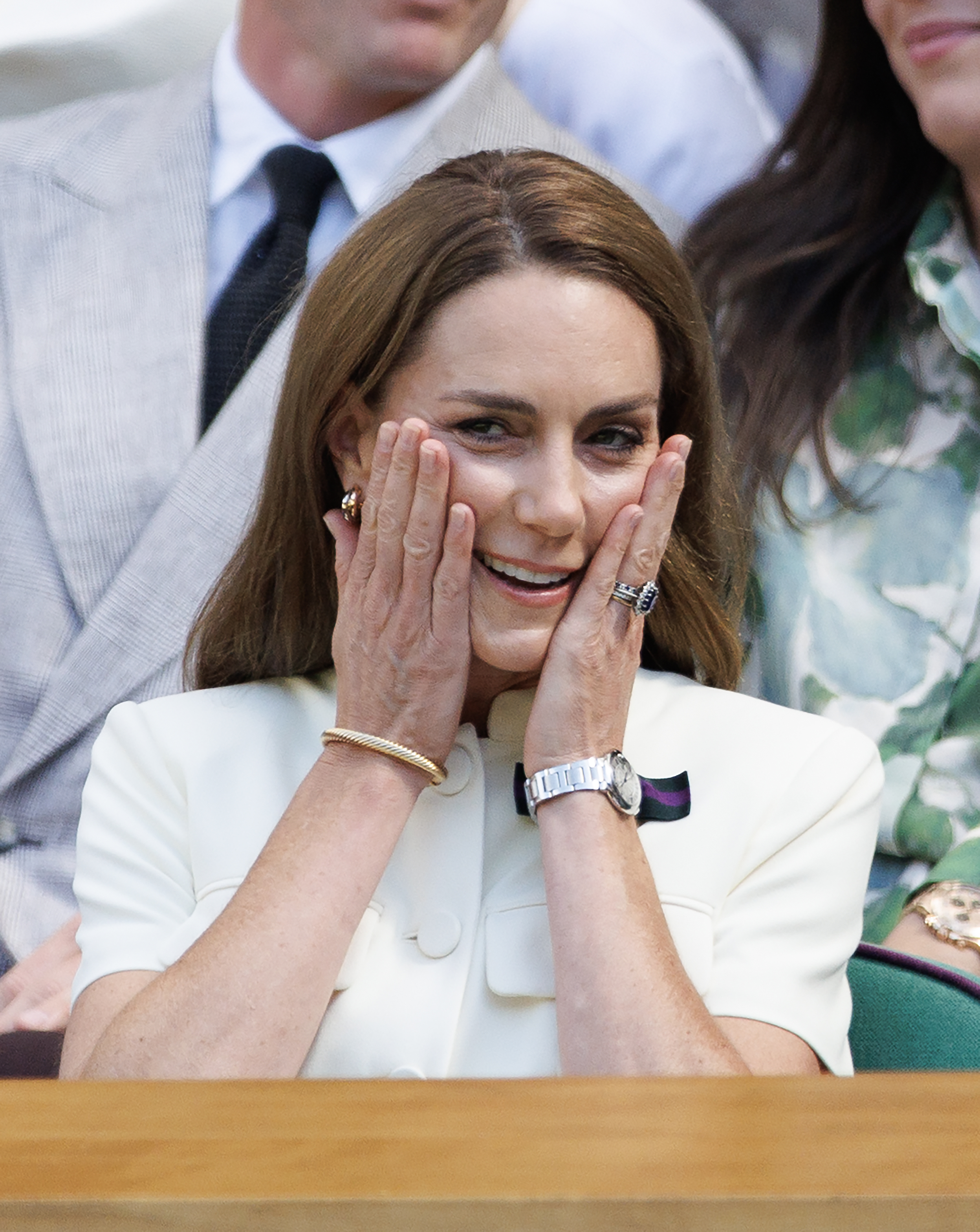 Kate Middleton reacting to a Wimbledon match with her hands over her face