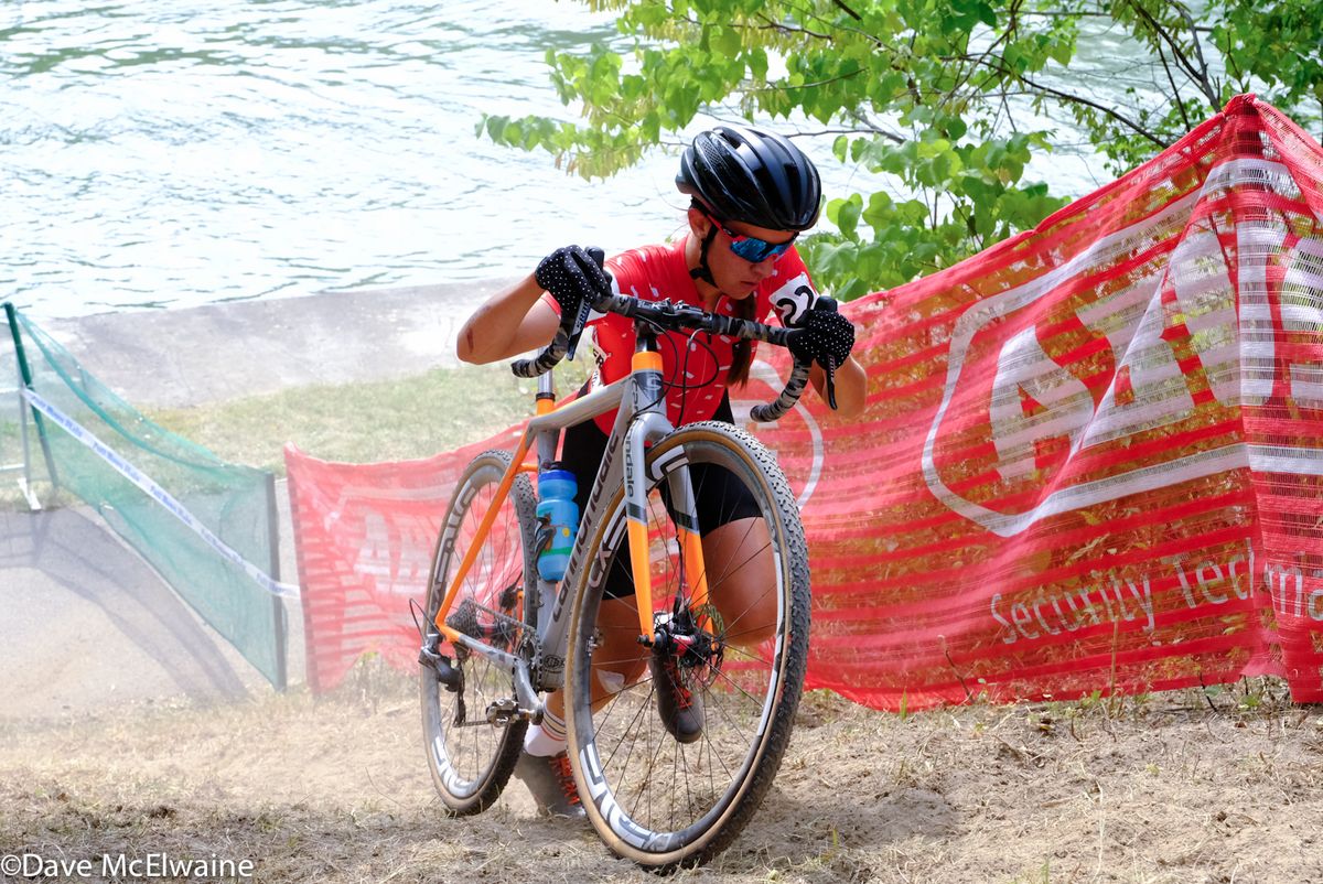 Sophia Gomez Villafane (Ten Speed Hero) pushes her bike on a very steep run-up
