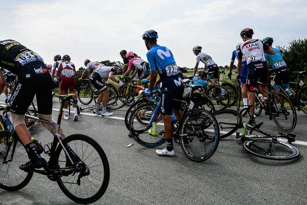 Riders are caught up in a crash near the end of the stage 4 at the Tour de France