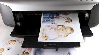Photo prints on an inkjet printer.