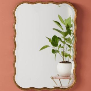 Wall mirror with scalloped edge