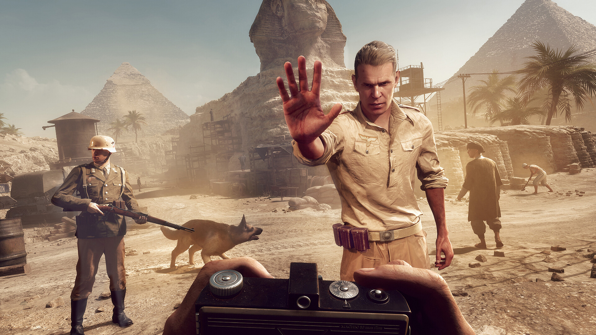 Indiana Jones and the Great Circle screenshot showing a German soldier holding up their hand to stop Indiana Jones, while another soldier and a dog stand in the background in front of the sphinx