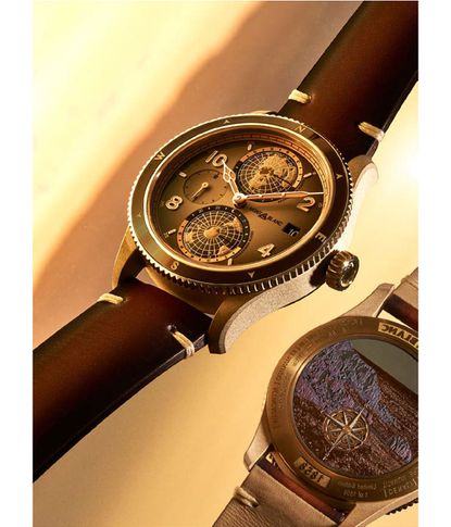 A close-up of Montblanc's new watch with rotating globes at the top and bottom of the watch face and a mini-timer circle on the left. Right side is a square for the date. The watch face is brown in colour with light brown arms. The face has 10, 2, 4, 8 numerals and a small line at 55, 5, 25, 35 and 45. The outer ring has a brown colour with light colour for the N, E, S, W locations. The watch-strap is dark-leather brown.