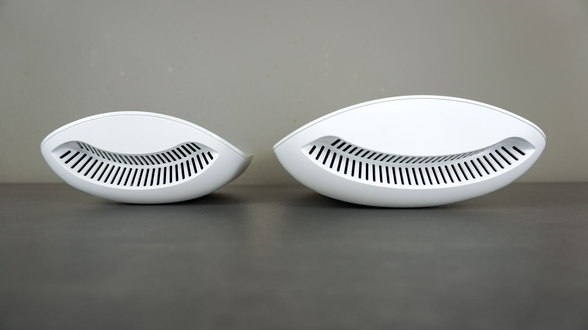 The eero Pro 7 next to the eero Max 7 face up on a desk