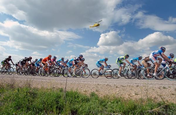 A television helicopter hovers above the peloton during stage four.