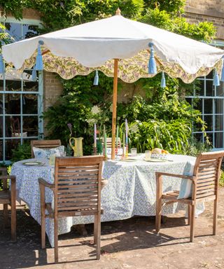 beautiful garden table setting with statement parasol