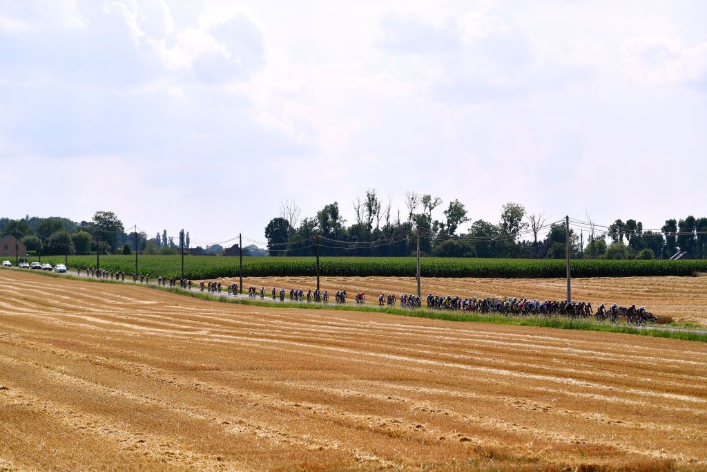 HUY BELGIUM JULY 23 A general view of the peloton passing through a landscape during the 43rd Ethias Tour de Wallonie 2022 Stage 1 a 1744km stage from Temploux to Huy 204m ethiastourdewallonie22 on July 23 2022 in Huy Belgium Photo by Luc ClaessenGetty Images