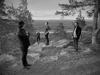 black and white group shot of Onsegen Ensemble in the Finnish countryside