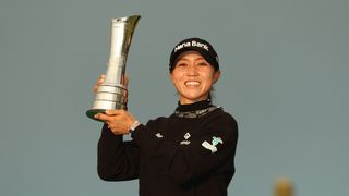 Lydia Ko holds up the 2024 AIG Women's Open trophy after her two-stroke victory at St. Andrews