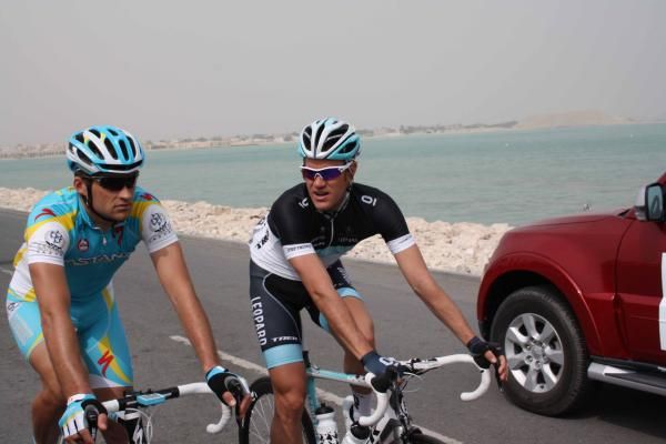 Simon Clark (Astana) chats with Stuart O'Grady (Leopard Trek).