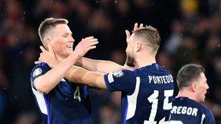 Scott McTominay and Ryan Porteous of Scotland celebrate victory ahead of the Spain vs Scotland live stream.