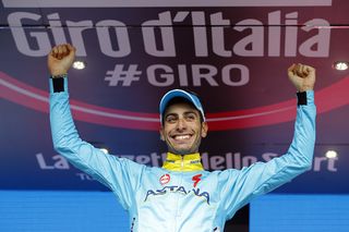 Fabio Aru (Astana) stands on the stage 19 podium as the winner on the day