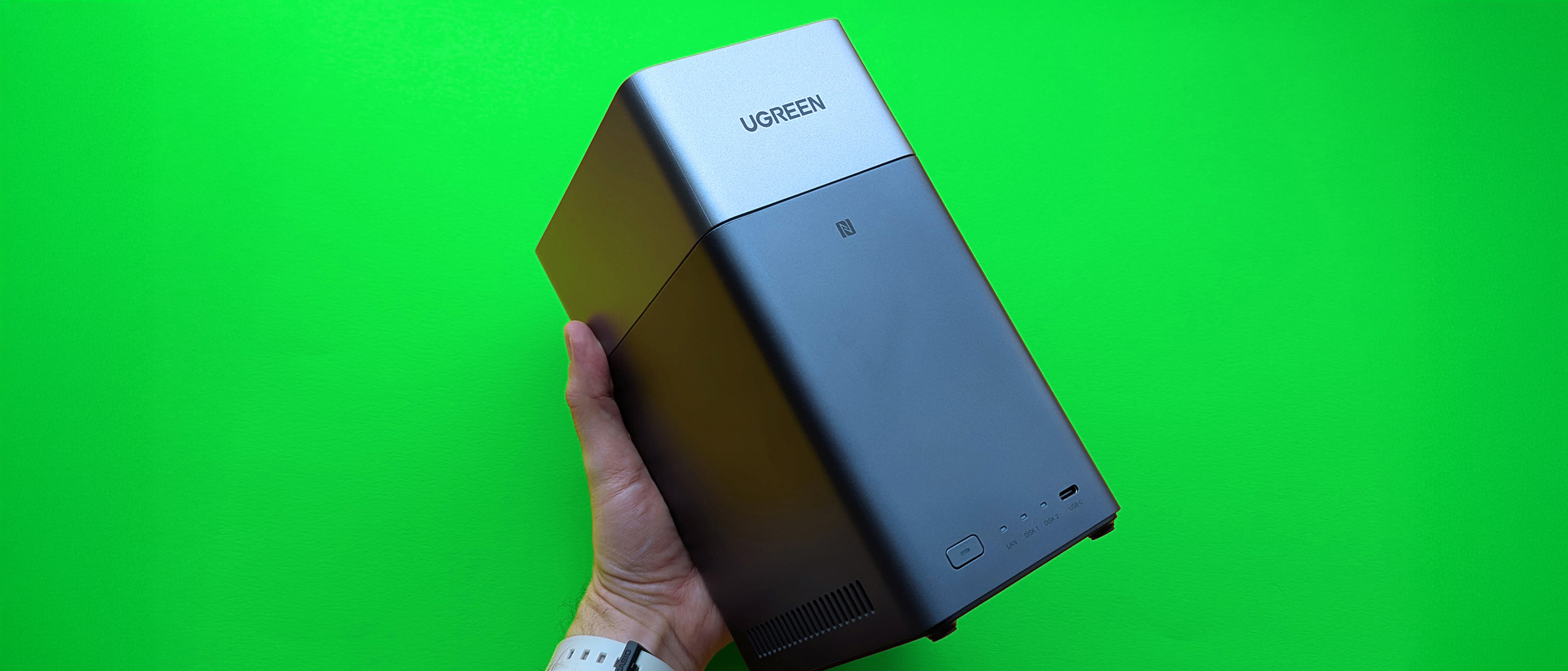 UGREEN NASync DH2300 on a green card paper background