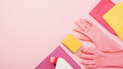 Pink cleaning products on a pink background