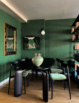 A green and black dining room