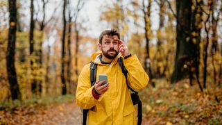 Hiker with phone lost in woods