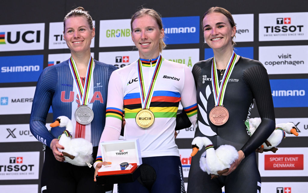 (LtoR) Second placed US' Jennifer Valente, winner Netherlands' Lorena Wiebes and third placed New Zealand's Ally Wollaston celebrate on the podium after the women's scratch race of the UCI Track Cycling World Championships in Ballerup, Denmark, on October 16, 2024. (Photo by Jonathan NACKSTRAND / AFP)