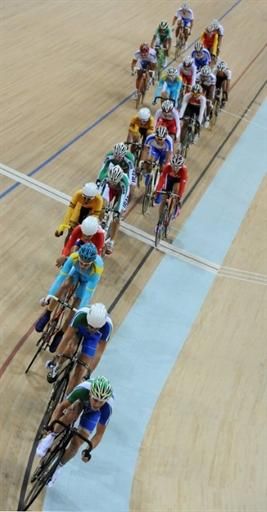 Eventual gold medalist Vladimir Tuychiev (Uzbekistan) at the head of the men's points race field.