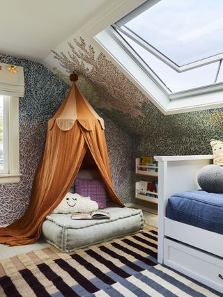 A kids bedroom corner with a skylight and a play den