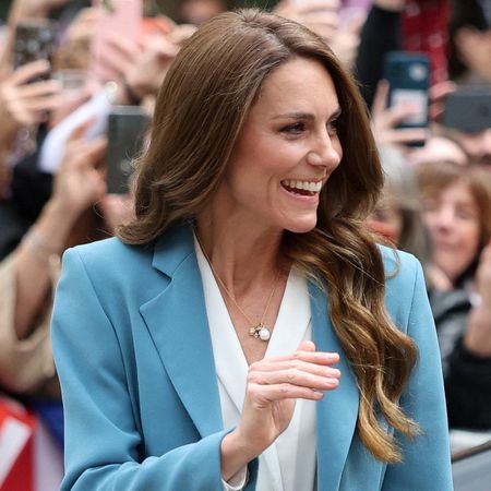 Princess Kate waving in a blue suit