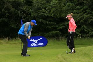 Mizuno #YourGame2016 campaigner, Peter Jones, gets some expert chipping advice from LET star, Amy Boulden