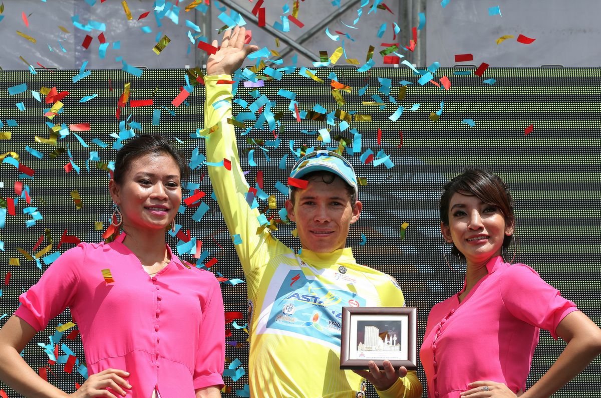 Miguel Lopez on the podium in yellow