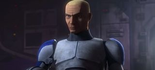 a bald character in white armor scowls at an unseen person