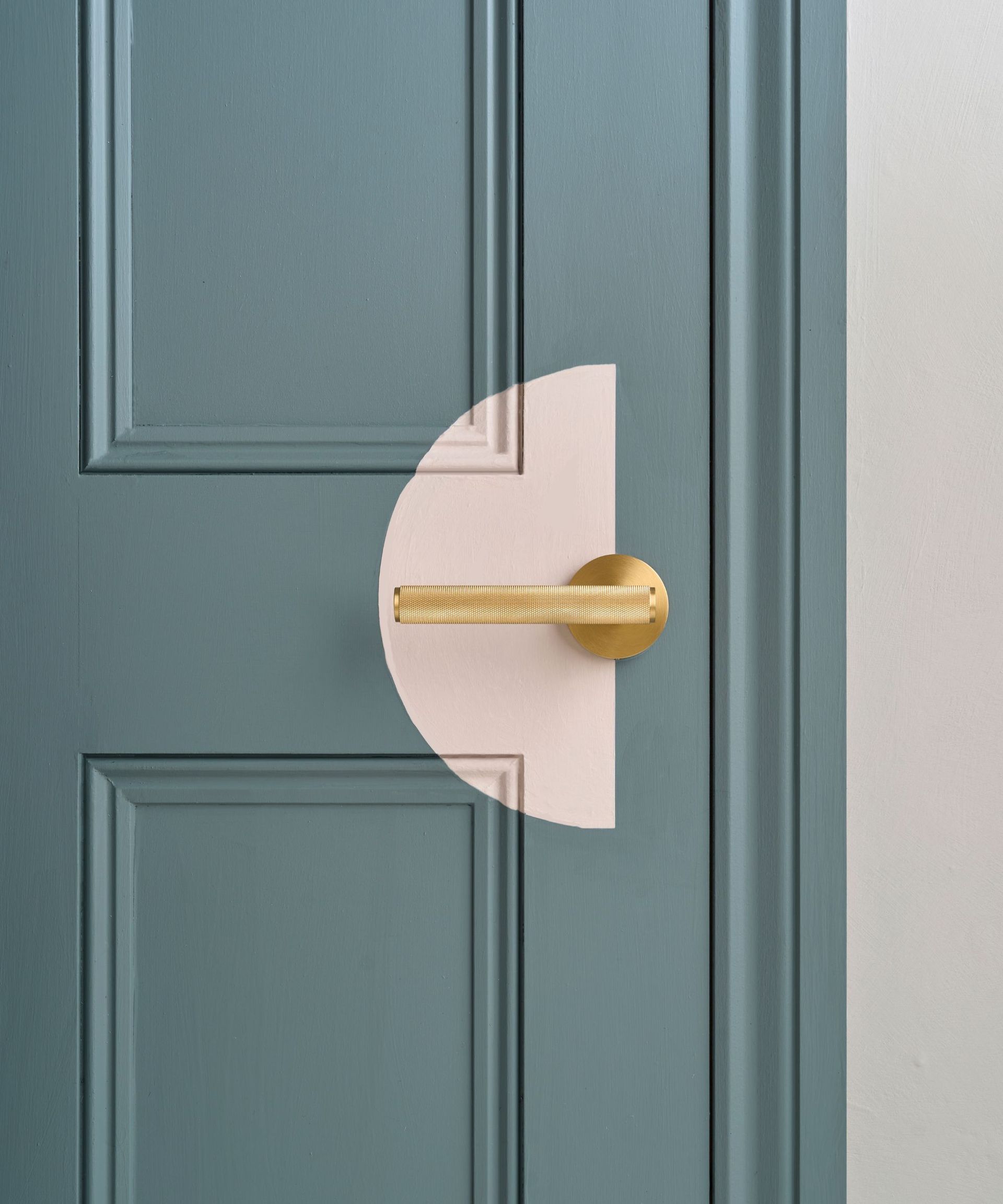 A grey internal door with a painted motif of a pink semi circle by the door knob