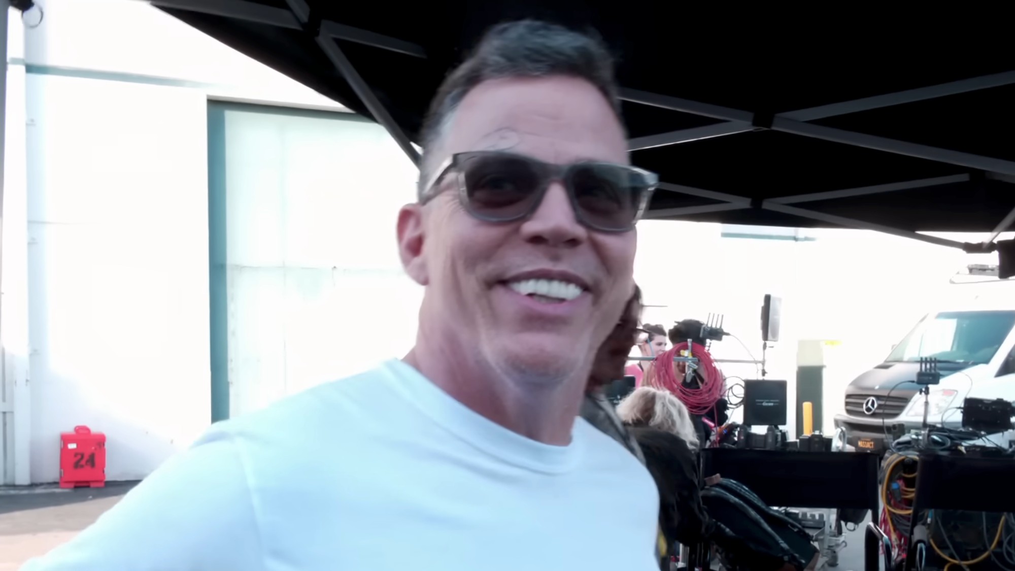 Steve-O smiling and wearing sunglass behind the scenes in Jackass: Best and Last