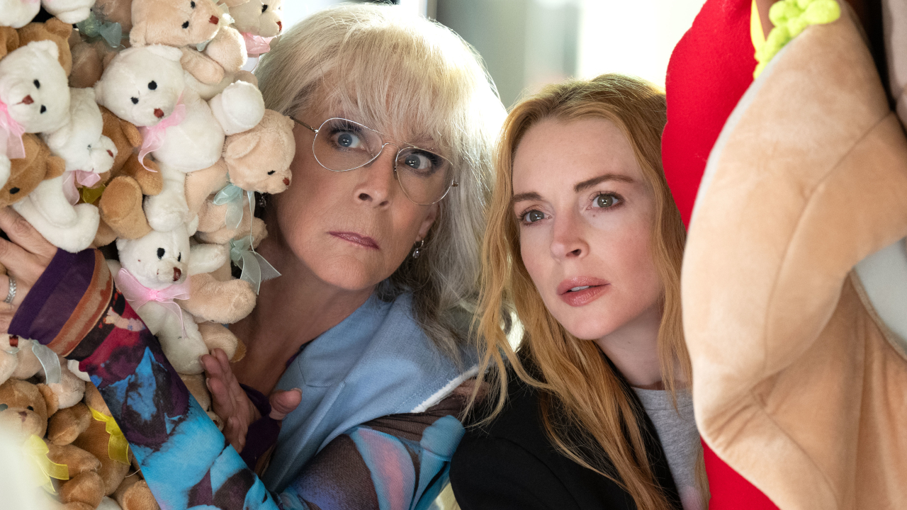 Jamie Lee Curtis and Lindsay Lohan peeking through a bunch of stuffed animals in Freakier Friday.